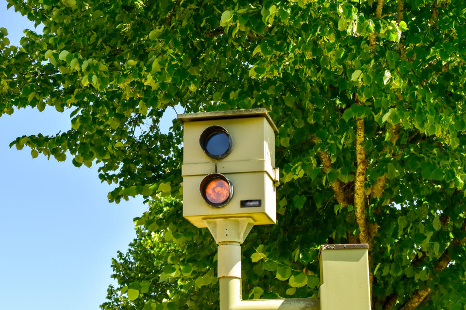 A traffic enforcement camera (also red light camera, road safety camera, road rule camera, photo radar, photo enforcement, speed camera, Gatso, safety camera, bus lane camera, flash for cash, Safe-T-Cam, depending on use).