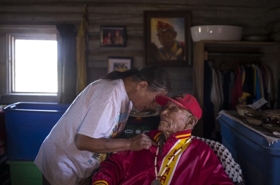 Ronald Kinsel talks with his father, Navajo Code Talker John Kinsel, Sr. on July 11, 2019, at their home in Lukachukai, Arizona.