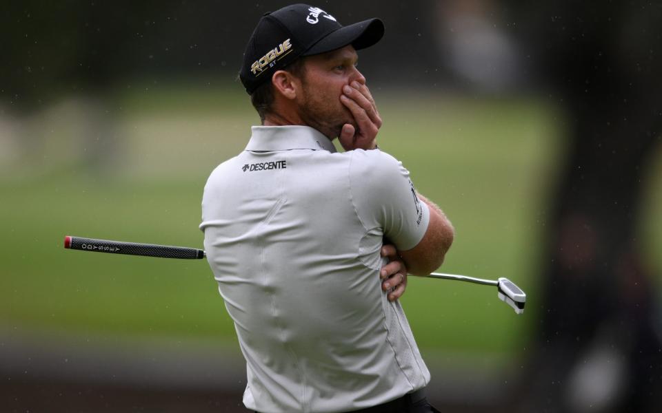 Danny Willet struggles to hide his shock after three-putting on the final green of the Fortinet Championship - GETTY