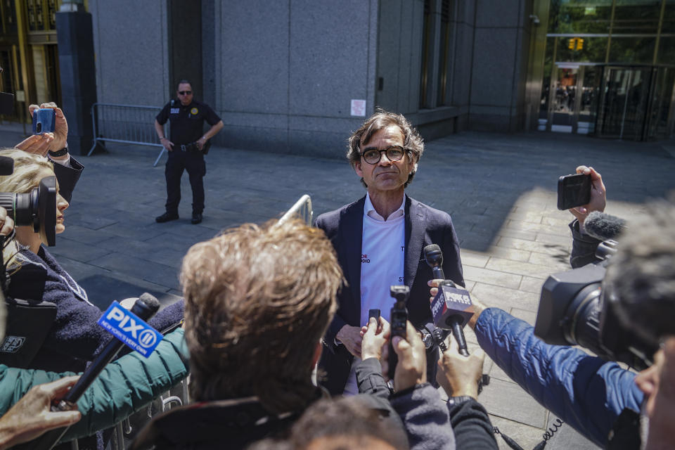 Aristide Melissas, center, speaks with media outside Manhattan federal court, after making a victim impact statement at the sentencing hearing of convicted Islamic terrorist Sayfullo Saipov, Wednesday, May 17, 2023, in New York. Saipov carried out an attack on Halloween in 2017 when he ran his rented truck onto a bike path in lower Manhattan killing eight people and injuring others. (AP Photo/Bebeto Matthews)