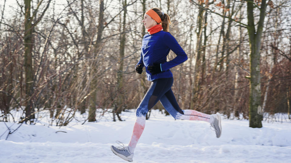 A woman running in the snow