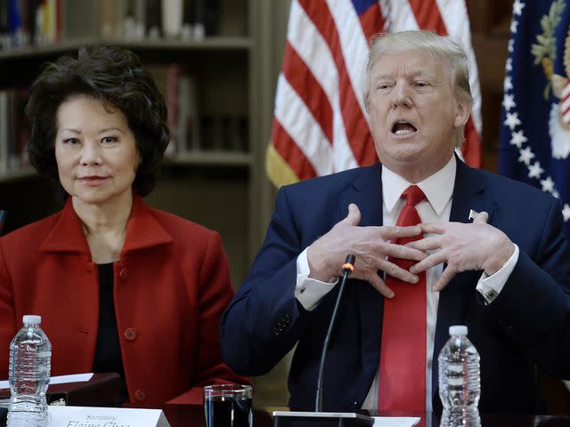 <p>Olivier Douliery-Pool/Getty</p> Elaine Chao and Donald Trump at the Eisenhower Executive Office Building in Washington, D.C. on April 11, 2017.