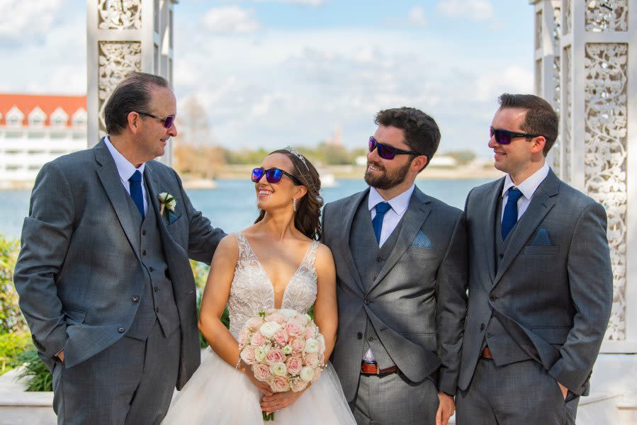 Bride Kristin Robinson, who is colorblind, sees the world in color for the first time as she celebrates her dream wedding alongside her groom and family at Disney’s Wedding Pavilion on January 25, 2023 at Walt Disney World Resort in Lake Buena Vista, Fla. (Abigail Nilsson, photographer)