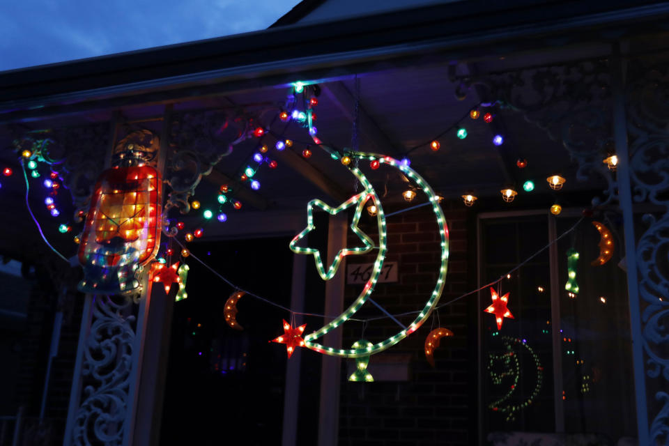 In this Tuesday, April 28, 2020 photo, Ramadan lights are displayed on a house in Dearborn, Mich. The Muslim community in Dearborn is starting a new tradition this year. The community is hosting a Ramadan lights competition in hopes of spreading joy and bringing back some of the holiday spirit during the coronavirus pandemic. (AP Photo/Carlos Osorio)