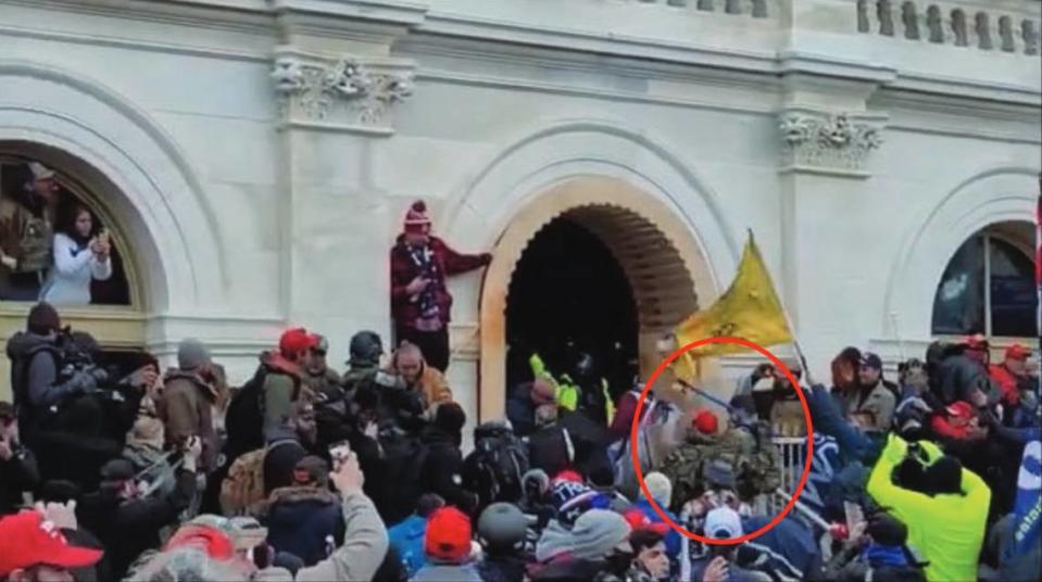 An image from the US Attorney’s Office shows Anthony Mastanduno, circled in red, with a pole-like object as he approaches a line of officers at the U.S. Capitol in Washington, D.C. on Jan. 6, 2021.
