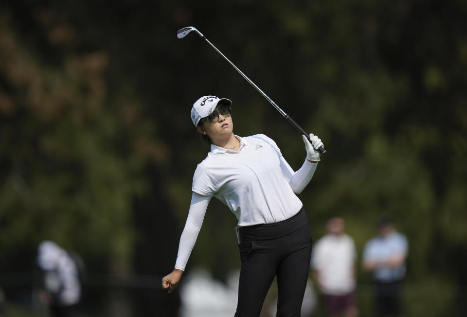 Rose Zhang, of the United States, watches her second shot from the fairway on the seventh hole during the first round at the CPKC Canadian Women's Open golf tournament in Vancouver, British Columbia, Thursday, Aug. 24, 2023. (Darryl Dyck/The Canadian Press via AP)