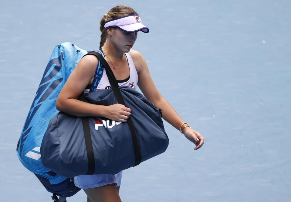 United States' Sofia Kenin leaves the court following her second round loss to Estonia's Kaia Kanepi during at the Australian Open tennis championship in Melbourne, Australia, Thursday, Feb. 11, 2021.(AP Photo/Rick Rycroft)