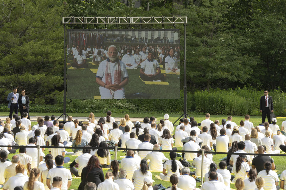 India Prime Minister Narendra Modi appears on the screen during the International Yoga day event at United Nations headquarters in New York on Wednesday, June 21, 2023. Modi has joined diplomats and dignitaries at the United Nations for a morning session of yoga, praising it as “truly universal” and “a way of life.” Modi kicked off the public portion of his U.S. visit at an event honoring the International Day of Yoga. (AP Photo/Jeenah Moon)