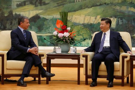China's President Xi Jinping (R) talks with Chief Executive Officer of Disney Bob Iger as they meet at the Great Hall of the People in Beijing, China, May 5, 2016. REUTERS/Kim Kyung-Hoon