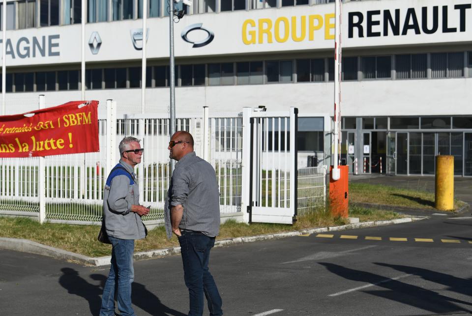 Demonstrators stand in front of the entrance of the "Fonderie de Bretagne" foundry, a subsidiary of Groupe Renault, on May 28, 2020 in Caudan, western France. - French auto giant Renault plans to cut around 15,000 jobs worldwide, including 4,600 in France, as part of a two billion euro cost-cutting plan over three years, sources said on May 28, 2020. (Photo by Fred TANNEAU / AFP) (Photo by FRED TANNEAU/AFP via Getty Images)