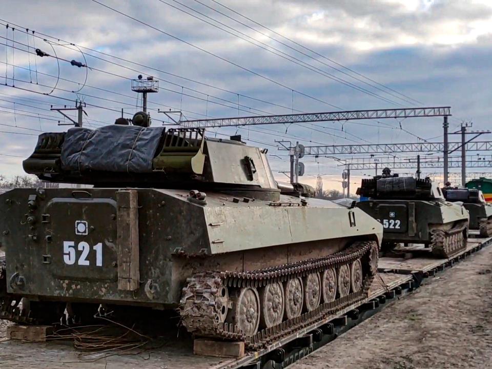 Russian tanks move along a railway in South Russia near Ukraine