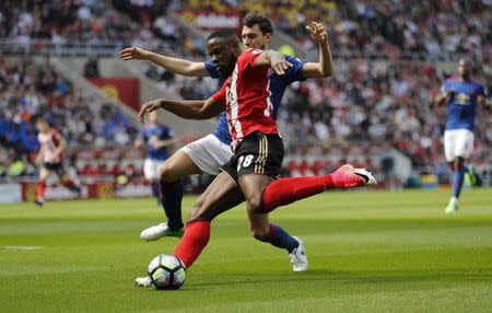 Britain Football Soccer - Sunderland v Manchester United - Premier League - Stadium of Light - 9/4/17 Sunderland's Victor Anichebe in action with Manchester United's Matteo Darmian Reuters / Russell Cheyne Livepic