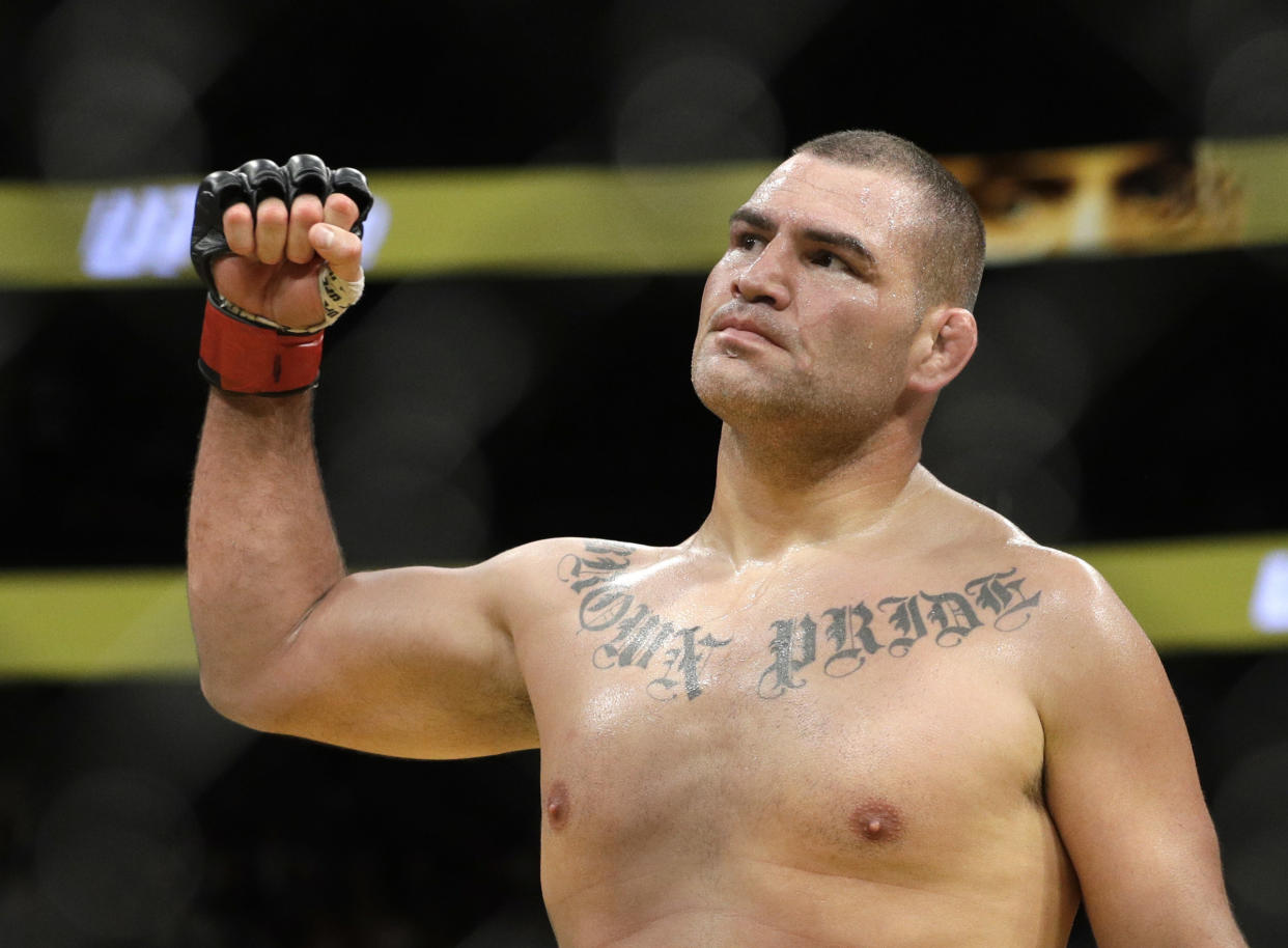 Cain Velasquez celebrates after defeating Travis Browne during their heavyweight mixed martial arts bout at UFC 200, Saturday, July 9, 2016, in Las Vegas. (AP Photo/John Locher)