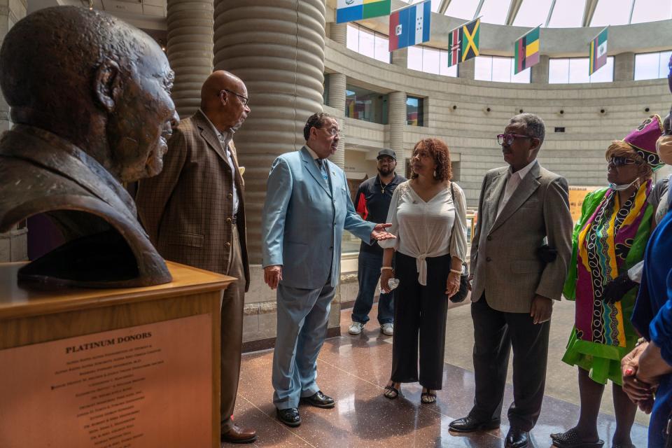 Retired judge Craig Strong, of Detroit, talks with his colleagues (left to right) Tyrone Davenport, of Detroit, left, Barbara K. Hughes Smith, of Detroit, Sherman Eaton and Barbara Mapson, of Detroit, as they gathered for a photo at the Charles H. Wright Museum of African American History in Detroit on Thursday, June 2, 2022. Strong's wardrobe is known across the city and country, as he has been photographed with many celebrities throughout the years. However, the charismatic Judge Strong has always had a serious side rooted in charity and service. In retirement, he remains committed to uplifting Detroit and one of his lifelong causes is the Charles H. Wright Museum.