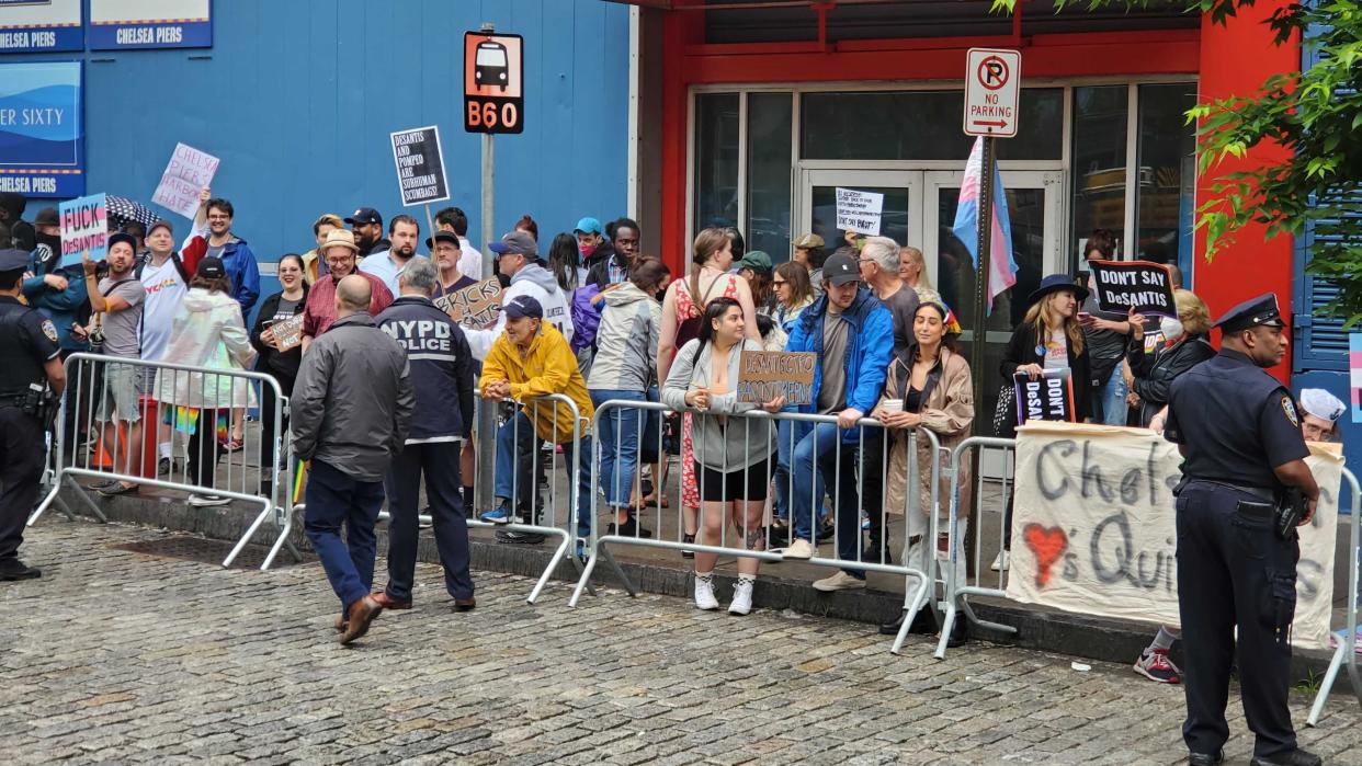 Demonstrators gathered outside Chelsea Piers to protest an appearance by Florida Gov. Ron DeSantis.