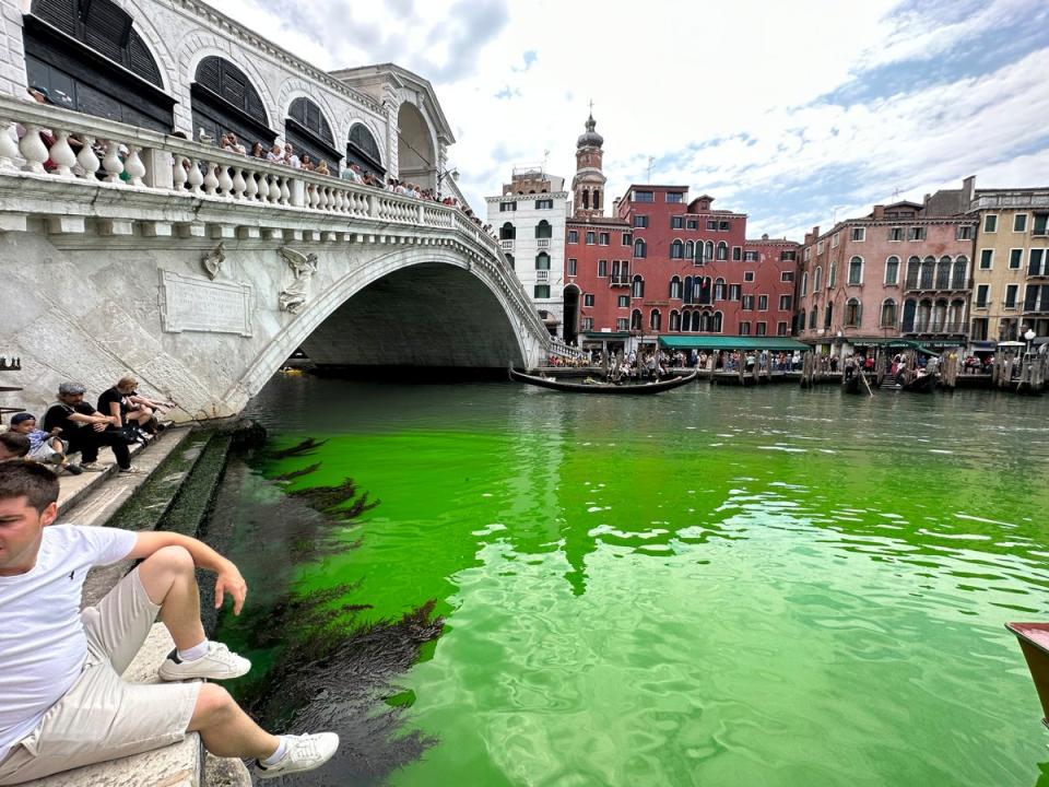 Venice’s Grand Canal was turned a bright green by the chemical fluorescein on Sunday (Copyright 2023 The Associated Press. All rights reserved)