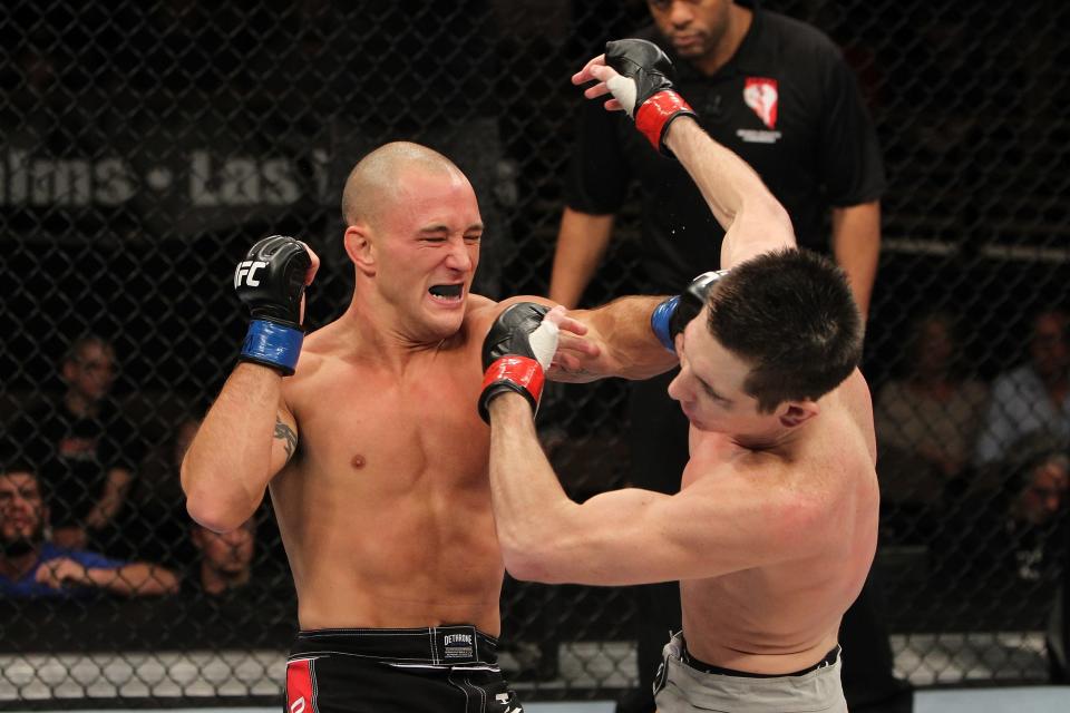 Josh Clopton hits Steven Siler (left to right) with a hard right hand during The Ultimate Fighter 14 Finale at the Pearl Theatre at the Palms Hotel and Casino on December 3, 2011 in Las Vegas, Nevada. (Photo by Josh Hedges/Zuffa LLC/Zuffa LLC via Getty Images)