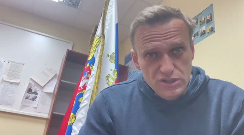 FILE PHOTO: Russian opposition leader Alexei Navalny speaks as he waits for a court hearing in a police station in Khimki