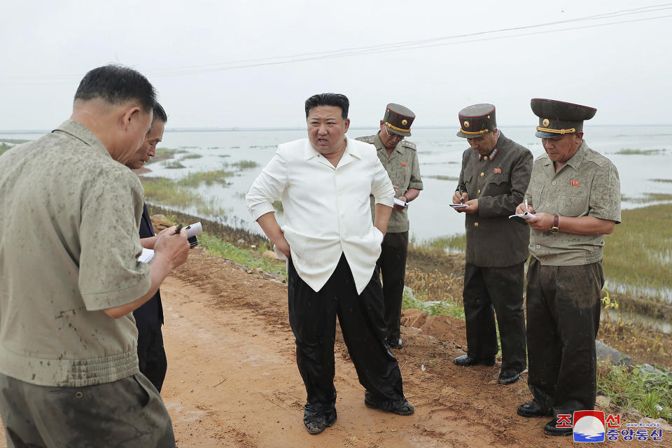 In this photo provided by the North Korean government, North Korean leader Kim Jong Un, center, visits a tideland under restoration in Nampho, North Korea Monday, Aug. 21, 2023. Independent journalists were not given access to cover the event depicted in this image distributed by the North Korean government. The content of this image is as provided and cannot be independently verified. Korean language watermark on image as provided by source reads: "KCNA" which is the abbreviation for Korean Central News Agency. (Korean Central News Agency/Korea News Service via AP)
