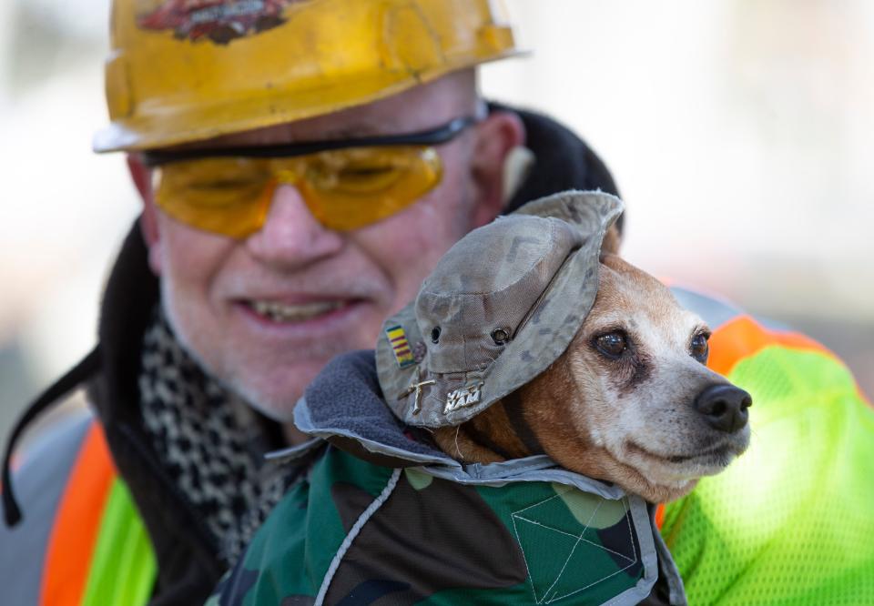 Peter Sztybel and his dog Whiskey, a 16-year-old Red Miniature Pinscher, seek out hidden, overgrown graves of military veterans and spruce them up. They are working in the Whiting Cemetery on this particular day.   Manchester, NJWednesday, January 12, 2022 