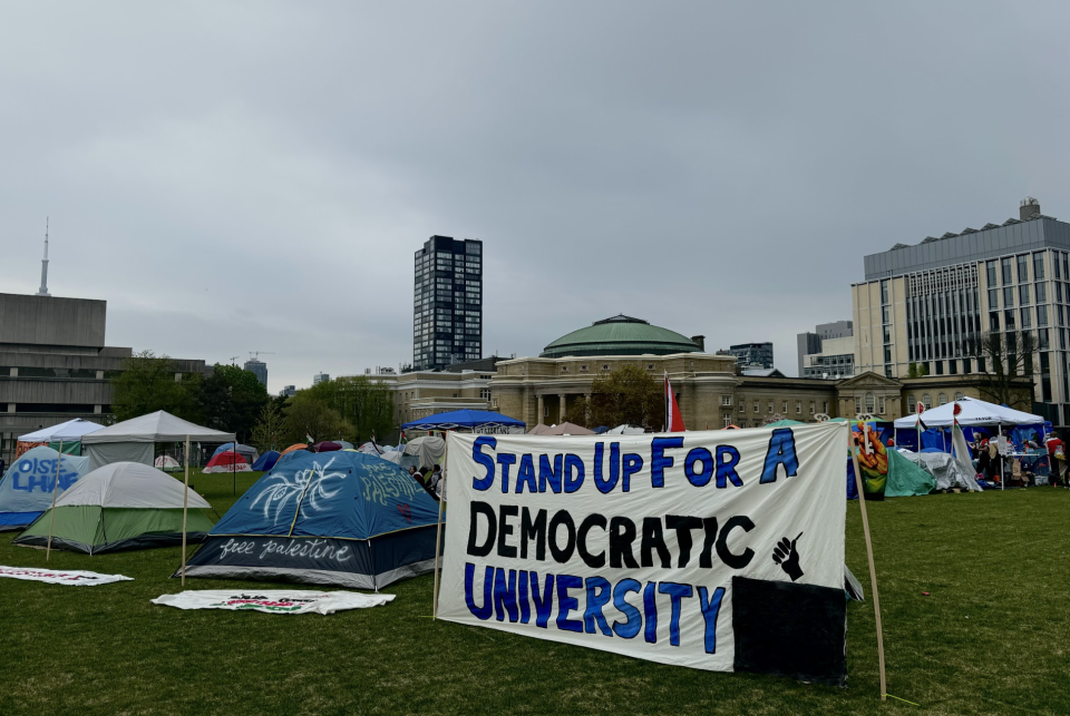 <p>Signs and various markings dot the encampment at U of T. (Credit: Corné van Hoepen)</p> 