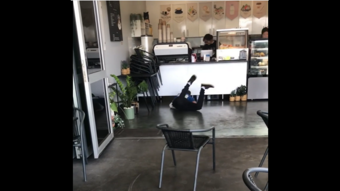 An Australian reptile catcher who gained notoriety earlier in the year for tugging a stubborn snake out of a toilet is getting laughs yet again, after video showed him chaotically chasing a monitor lizard through a cafe.