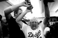 Pitcher Tom Niedenfuer pours champagne on manager Tommy Lasorda in the clubhouse after winning the 1981 NLDS playoffs at Dodger Stadium, Los Angeles, California. (Photo by Jayne Kamin-Oncea/Getty Images)