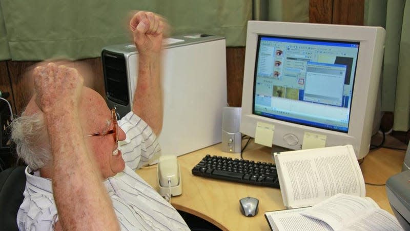 A man getting angry at his computer