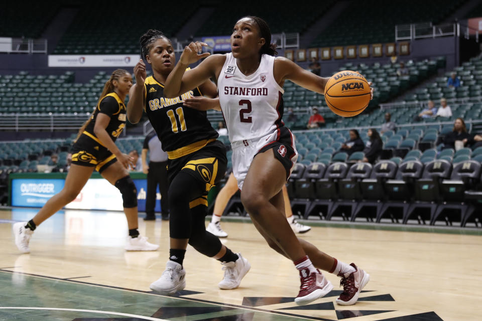 Stanford guard Agnes Emma-Nnopu (2) dribbles past Grambling State guard Colbi Maples (11) during the fourth quarter of an NCAA college basketball game, Saturday, Nov. 26, 2022, in Honolulu. (AP Photo/Marco Garcia)