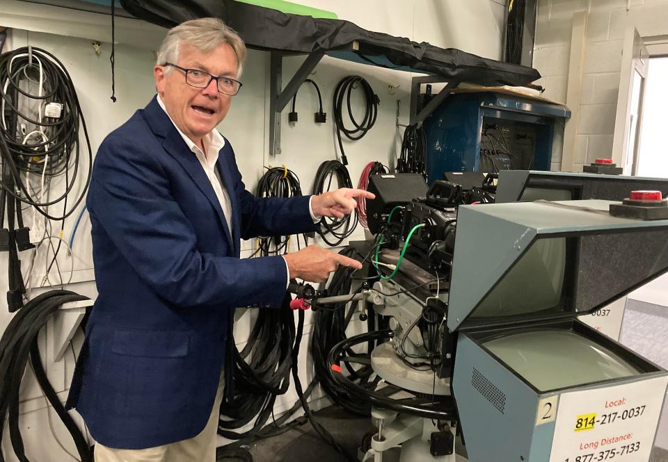 Tom New, president and CEO of WQLN PBS NPR, points out a 1970s-era camera stand in a studio at WQLN, 8425 Peach St., Summit Township. New, who has been at WQLN since 1998, says the cameras are much smaller these days.