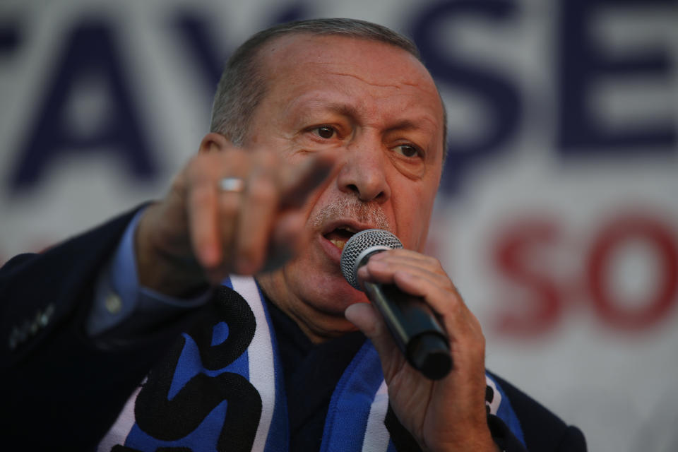 FILE-In this Tuesday, March 5, 2019 file photo, Turkey's President Recep Tayyip Erdogan delivers a speech at a rally of his ruling Justice and Development Party's (AKP) in Istanbul, ahead of local elections scheduled for March 31, 2019. After 17 years in office, Erdogan has a tight grip on power, but he is campaigning hard for a strong mandate that he says he needs to protect Turkey against threats from domestic and foreign enemies. (AP Photo/Lefteris Pitarakis,File)