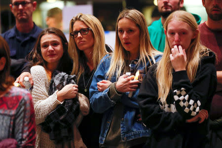 Mourners attend a vigil for the victims of the mass shooting, at the Thousand Oaks Civic Arts Plaza in Thousand Oaks, California, U.S. November 8, 2018. REUTERS/Mike Blake