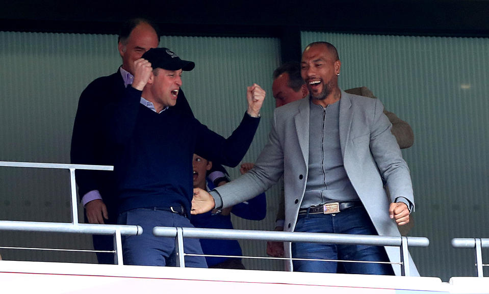 The Duke of Cambridge (left) celebrates in the stands with former footballer John Carew (right) after Aston Villa's Anwar El Ghazi scores his side's first goal of the game during the Sky Bet Championship Play-off final at Wembley Stadium, London.