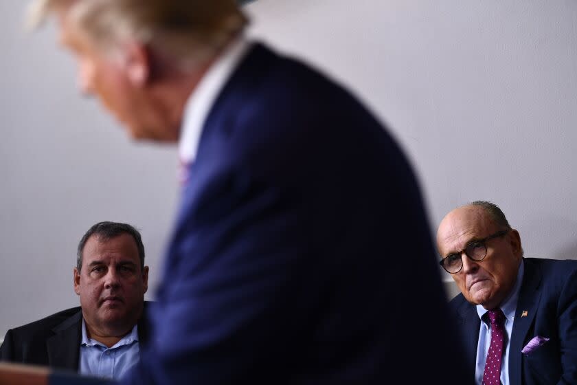 Former New Jersey Governor Chris Christie and Former New York City Mayor Rudy Giuliani listen while US President Donald Trump speaks during a briefing at the White House September 27, 2020, in Washington, DC. - US President Donald Trump paid just $750 in federal income taxes in 2016, the year he won the election, The New York Times reported September 27, 2020, citing tax return data extending more than 20 years. (Photo by Brendan Smialowski / AFP) (Photo by BRENDAN SMIALOWSKI/AFP via Getty Images)