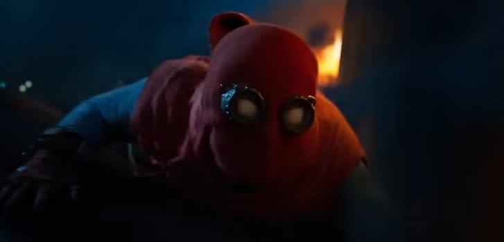 Spider-Man in his homemade suit holding onto a falling airplane in "Spider-Man: Homecoming"