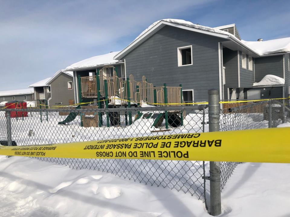 A playground just off Bigelow Crescent was taped off on Saturday. Police say a double homicide investigation points towards drug trafficking. (Sarah Krymalowski/CBC - image credit)