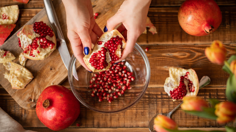 removing arils from pomegranate