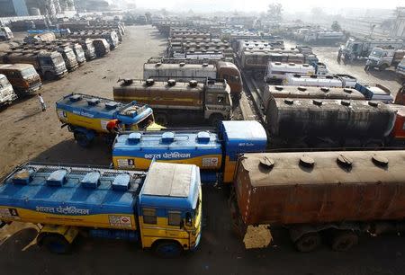 Oil tankers are seen parked at a yard outside a fuel depot on the outskirts of Kolkata February 3, 2015. REUTERS/Rupak De Chowdhuri/Files