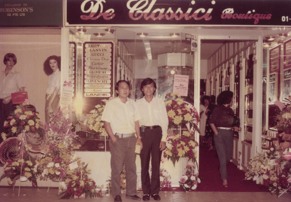 A young George Goh (left) at his shoe shop, which distributed and sold well known luxury brands. (PHOTO: George Goh Media Team)