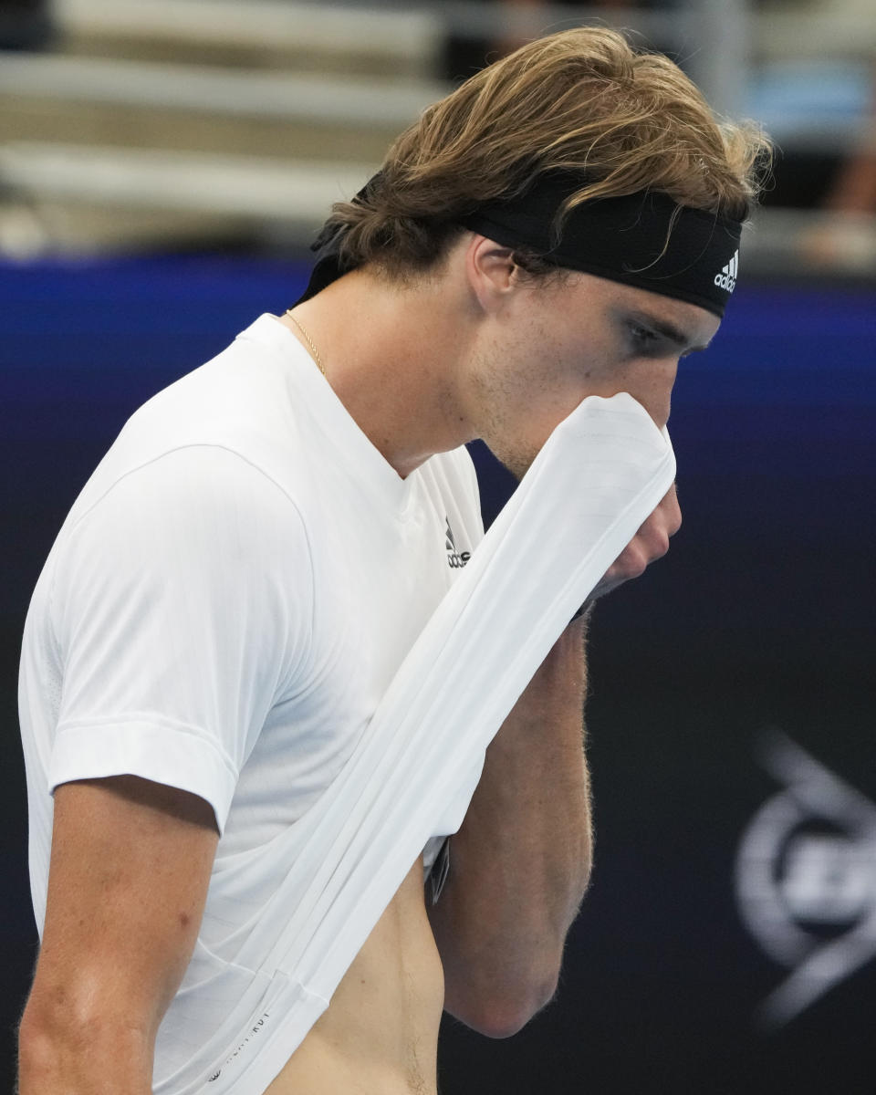 Germany's Alexander Zverev wipes the sweat from his face during his games against United States' Taylor Fritz during their Group C match at the United Cup tennis event in Sydney, Australia, Monday, Jan. 2, 2023. (AP Photo/Mark Baker)