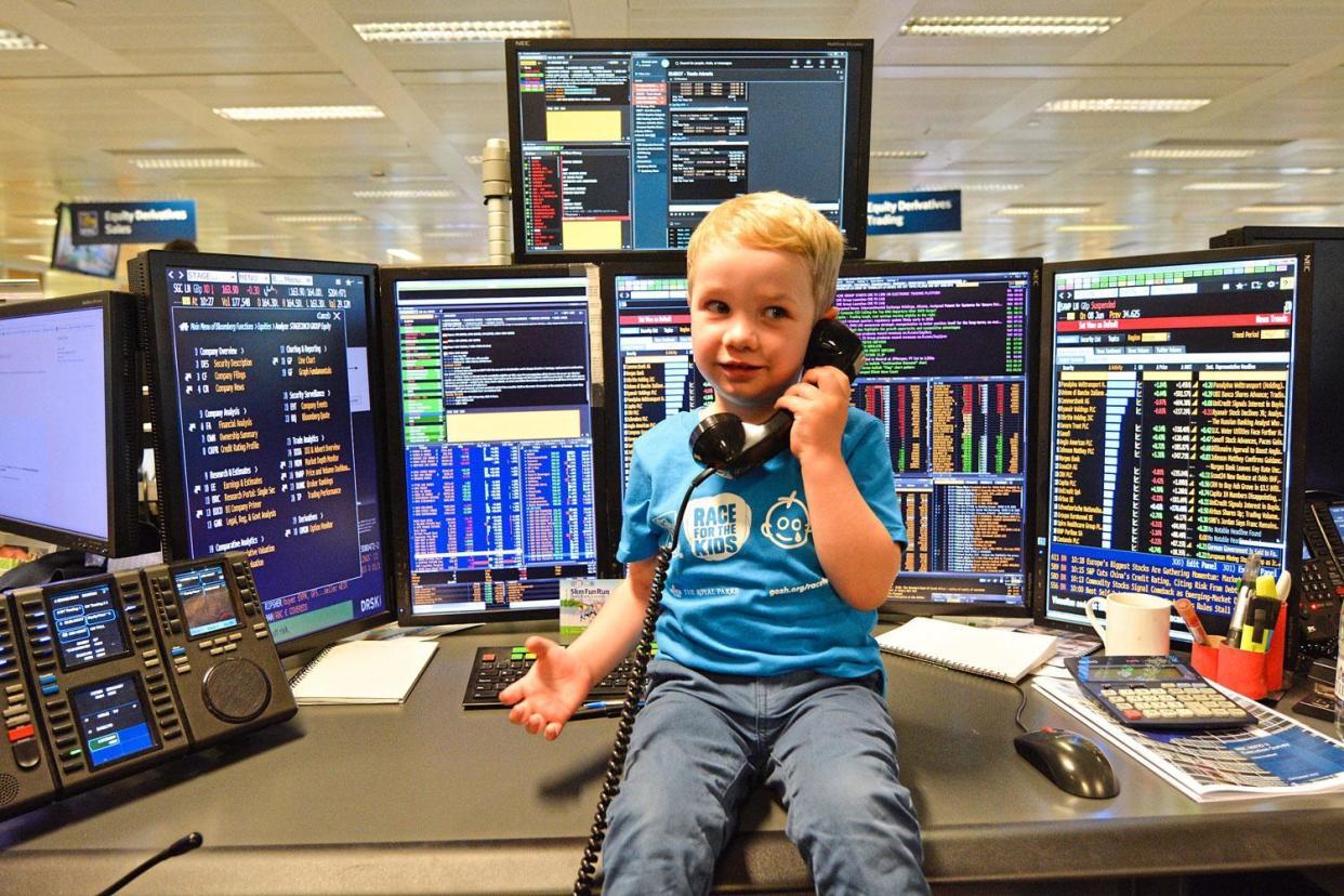 Elliott Livingstone, 3, at the Royal Bank of Canada's trading floor drumming up support for his run