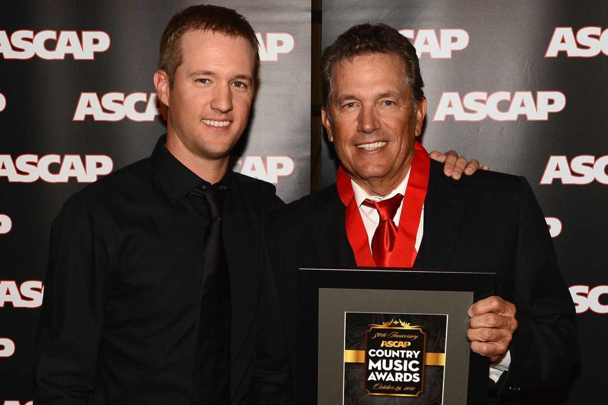 <p>Rick Diamond/Getty</p> George Strait and his son George "Bubba" Strait Jr. poses with award at the 50th Annual ASCAP Country Music Awards on October 29, 2012 in Nashville, Tennessee.
