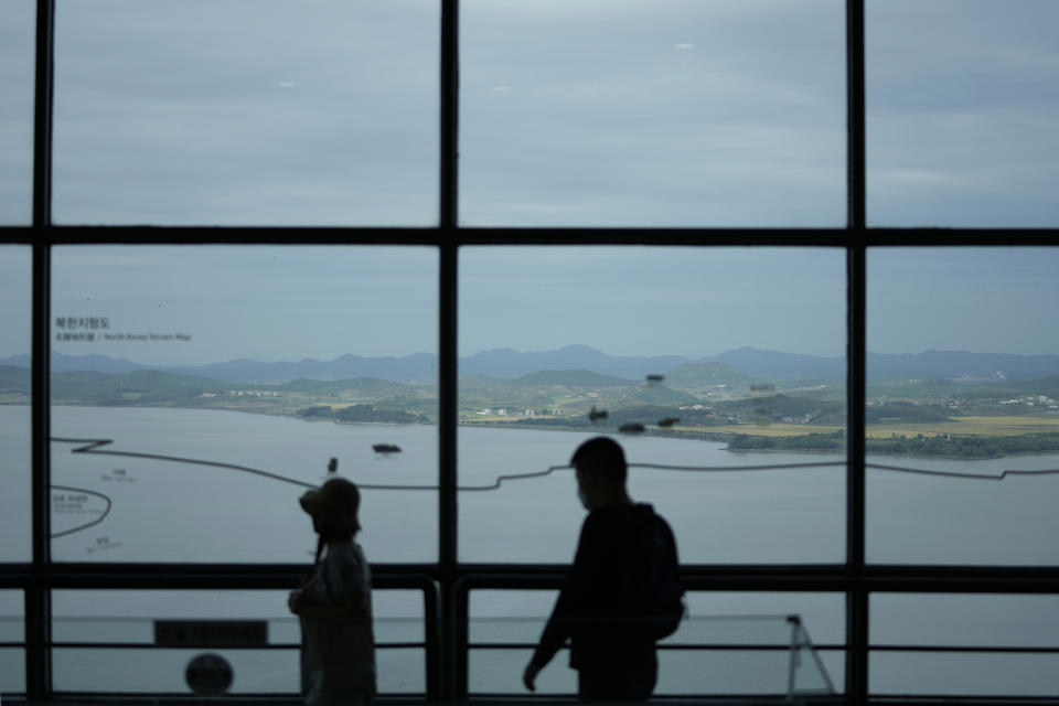 North Korea's Kaepoong town is seen as visitors tour to the unification observatory in Paju, South Korea, Tuesday, Sept. 28, 2021. North Korea fired a short-range missile into the sea early Tuesday, its neighboring countries said, in the latest weapon tests by North Korea that has raised questions about the sincerity of its recent offer for talks with South Korea. (AP Photo/Lee Jin-man)