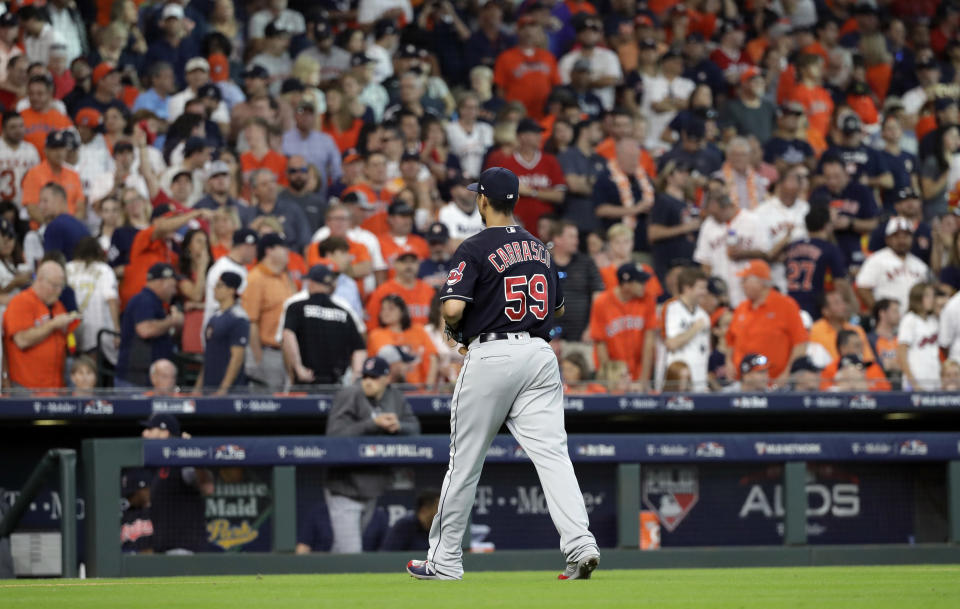 Cleveland Indians starting pitcher Carlos Carrasco (59) leaves after he was pulled in the sixth inning of Game 2 of a baseball American League Division Series against the Houston Astros, Saturday, Oct. 6, 2018, in Houston. (AP Photo/David J. Phillip)