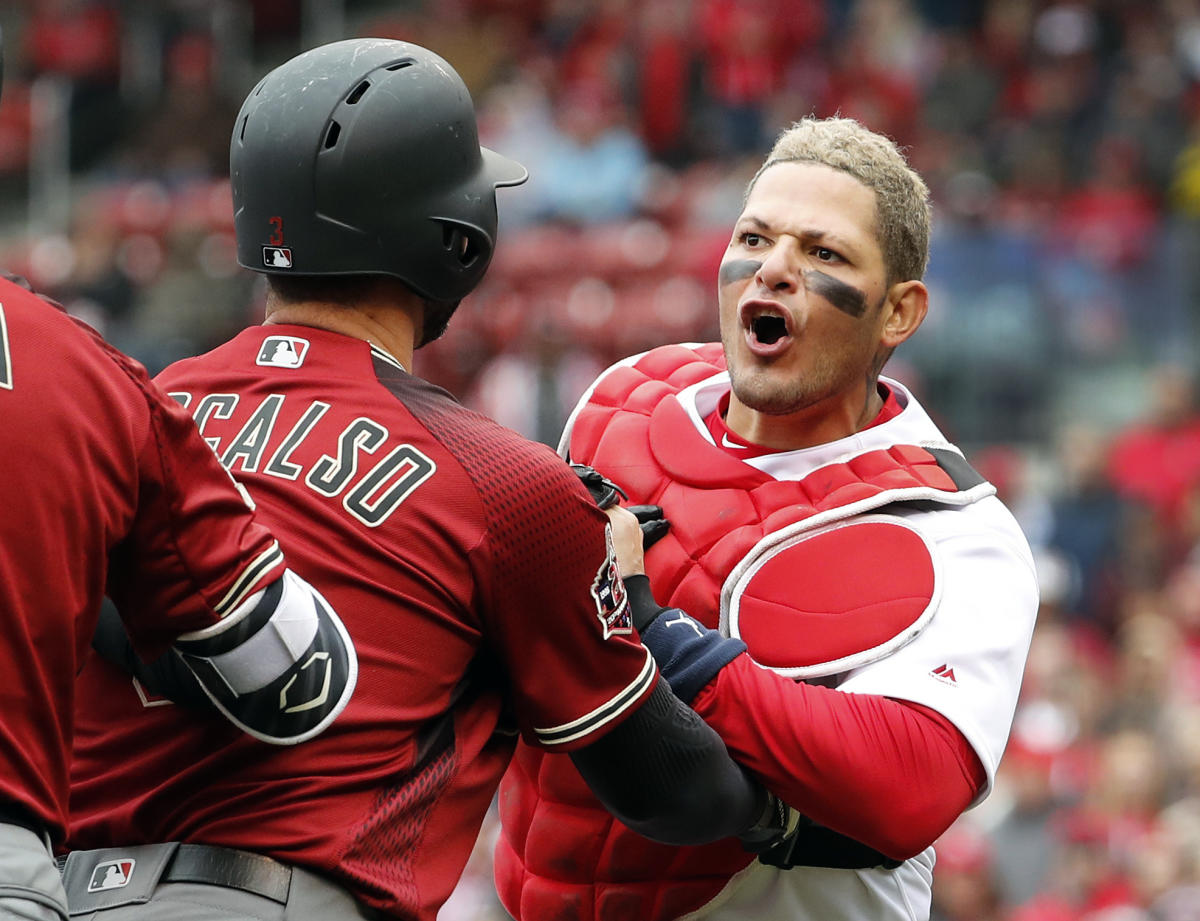 Yadier Molina somehow avoids ejection after putting hands on ump