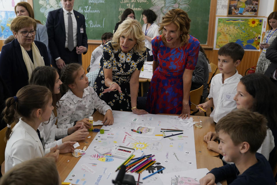 First lady Jill Biden and first lady of Romania Carmen Iohannis visit the Școala Gimnaziala Uruguay, or Uruguay School, in Bucharest Romania, Saturday, May 7, 2022. Biden visited several classrooms to visit with children and the educators who are helping teach displaced Ukrainian children. (AP Photo/Susan Walsh, Pool)