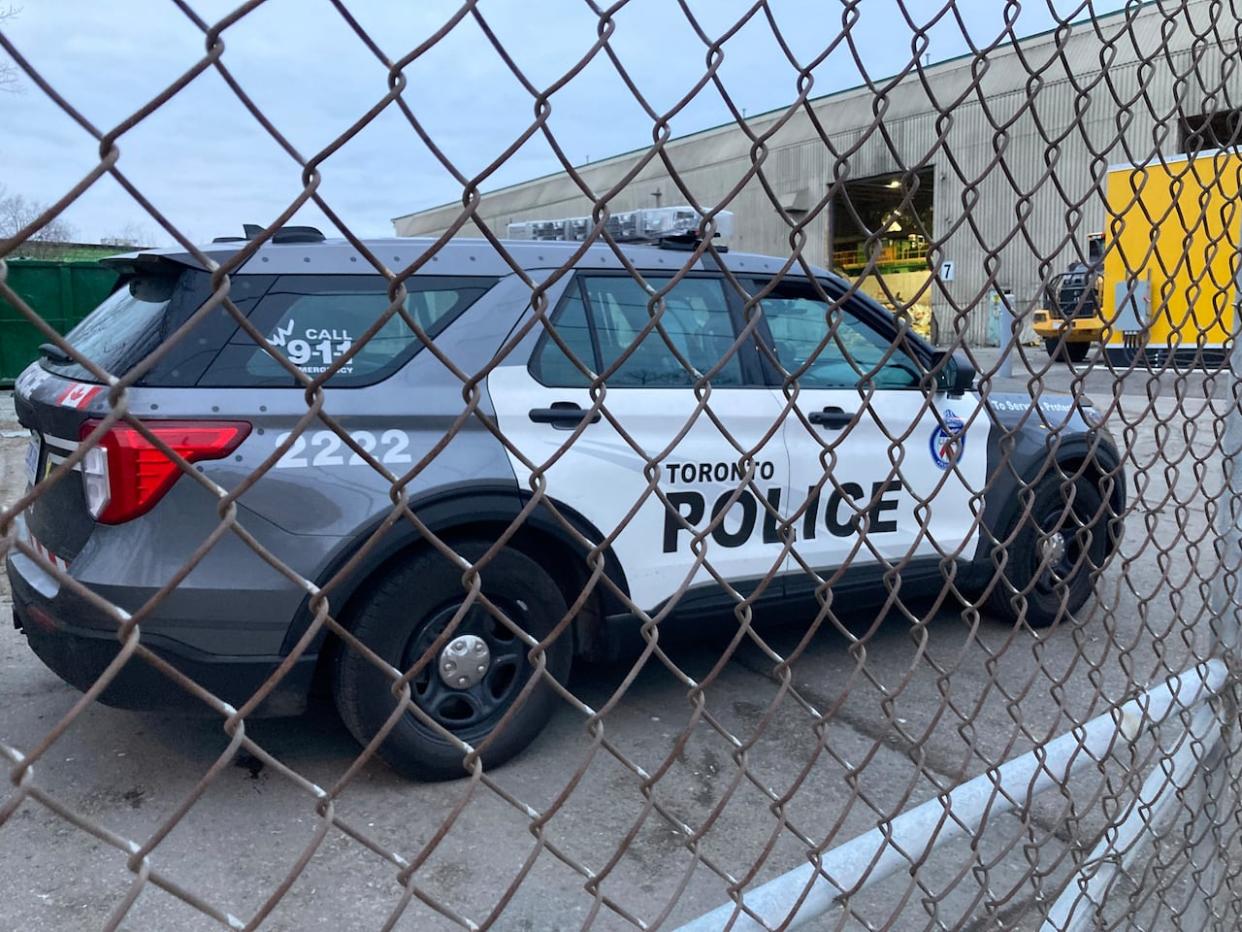 Police are working to identify the body of a man who was found at a waste management facility in Toronto on Friday.  (James Spalding/CBC - image credit)