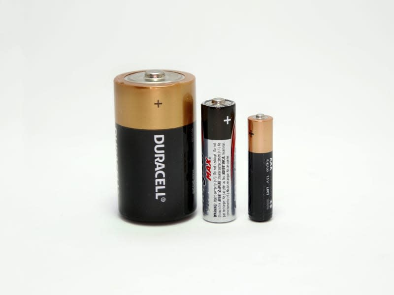 Batteries. Alkaline batteries. Single use batteries. Disposable batteries of brands Duracell, Kodak, Energizer. Isolated white. Different sizes AAA, AA, D. Technology. Energy. Battery.