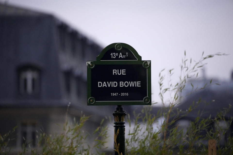 The street sign of singer David Bowie is pictured after being unveiled during a ceremony in Paris, Monday, Jan. 8, 2023. The city of Paris is immortalizing late British music icon David Bowie by naming a street after him in the city's southeast on what would have been his 77th birthday on Monday. (AP Photo/Christophe Ena)