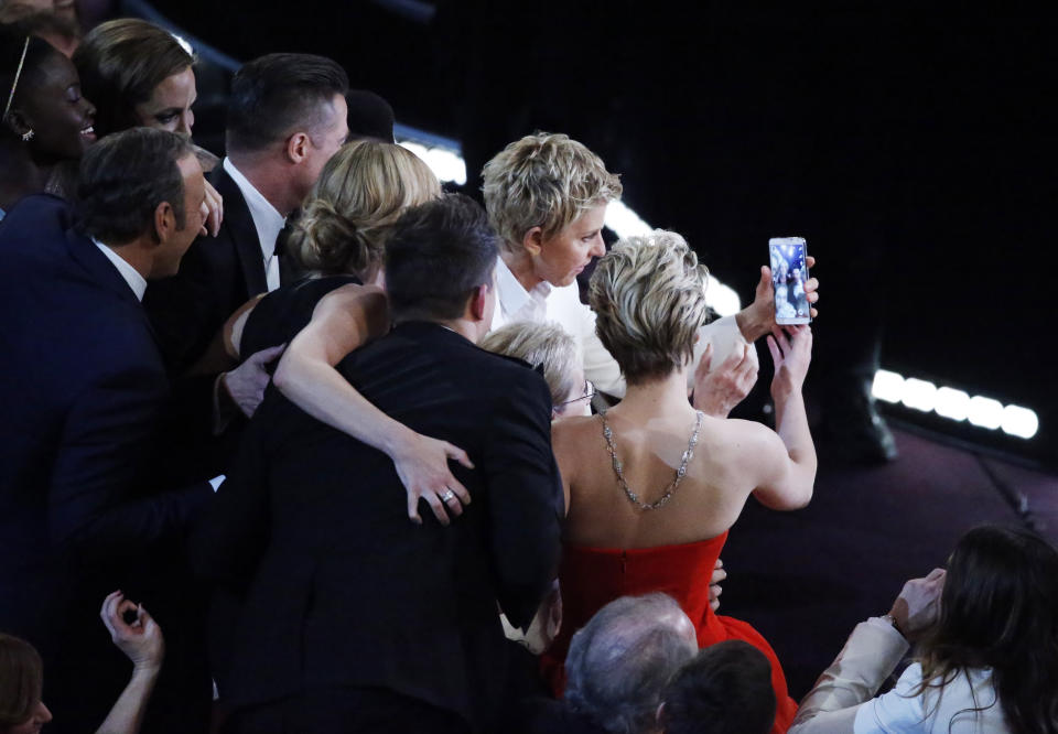 Host Ellen Degeneres takes a group picture at the 86th Academy Awards